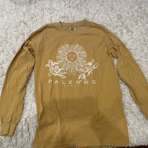 Graphics yellow long sleeve shirt.